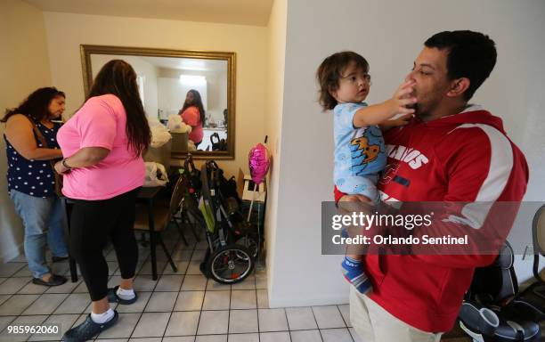 Left to right, Liza Hernandez, Christine Gonzalez, Kahil Olmeda Gonzalez and dad David Olmeda, at the Super 8 motel in Kissimmee, Fla., on May 25,...