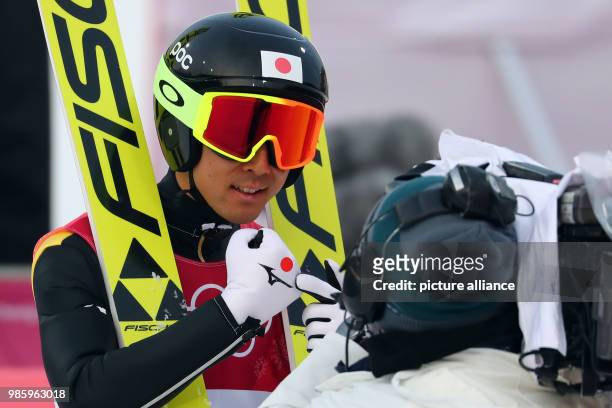 Akito Watabe from Japan after his jump during the Nordic combined event in the Alpensia Ski Jump Centre in Pyeongchang, South Korea, 14 February...