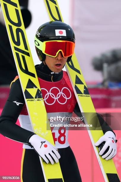 Akito Watabe from Japan after his jump during the Nordic combined event in the Alpensia Ski Jump Centre in Pyeongchang, South Korea, 14 February...