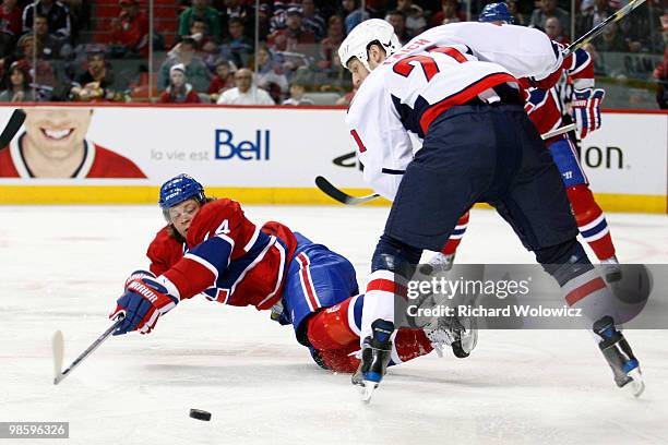 Brooks Laich of the Washington Capitals strips the puck from Sergei Kostitsyn of the Montreal Canadiens in Game Four of the Eastern Conference...