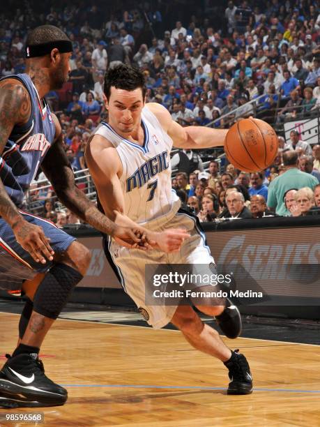 Redick of the Orlando Magic drives against Larry Hughes of the Charlotte Bobcats in Game Two of the Eastern Conference Quarterfinals during the 2010...