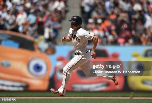 Nick Hundley of the San Francisco Giants runs the bases to score against the San Diego Padres in the bottom of the seventh inning at AT&T Park on...