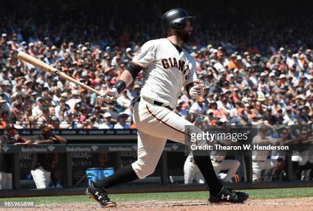 Brandon Belt of the San Francisco Giants bats against the San Diego Padres in the bottom of the six inning at AT&T Park on June 23, 2018 in San...