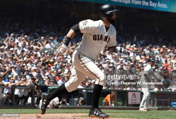 Brandon Belt of the San Francisco Giants bats against the San Diego Padres in the bottom of the six inning at AT&T Park on June 23, 2018 in San...