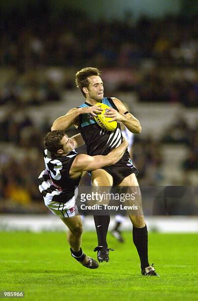 Darryl Wakelin for Port Adelaide is tackled by Tyson lane for Collingwood during the round 8 of the AFL match between Port Power and the Collingwood...
