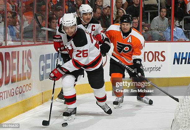 Patrik Elias of the New Jersey Devils skates against Kimmo Timonen of the Philadelphia Flyers in Game Four of the Eastern Conference Quarterfinals...