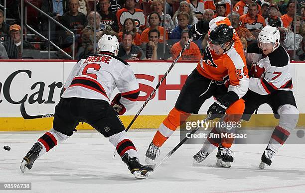 James van Riemsdyk of the Philadelphia Flyers skates against Paul Martin and Andy Greene of the New Jersey Devils in Game Four of the Eastern...