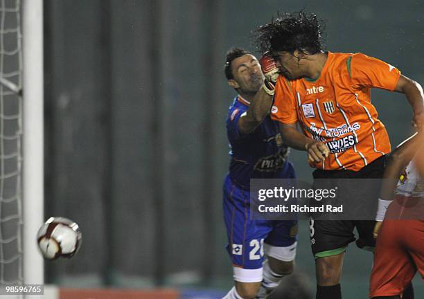 Ruben Ramirez of Argentina's Banfield heads the ball to score against Ecuador's Deportivo Cuenca during their Copa Libertadores soccer match at...