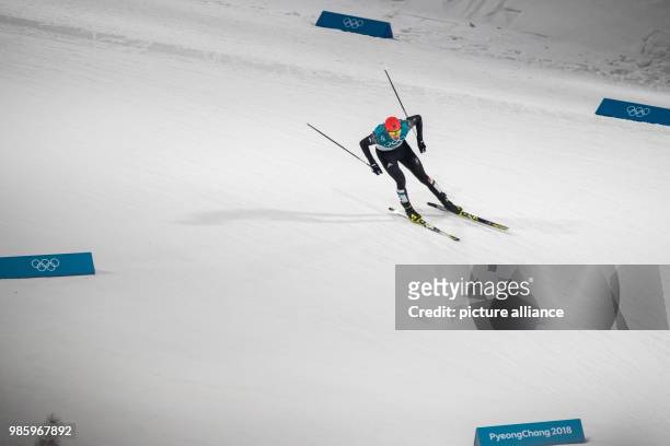 Eric Frenzel from Germany approaching the finish line during the Nordic combined event in the Alpensia Ski Jump Centre in Pyeongchang, South Korea,...