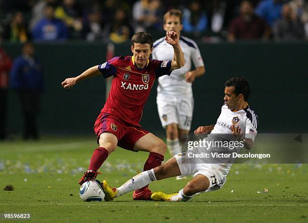 Will Johnson of Real Salt Lake and Juninho of the Los Angeles Galaxy vie for the ball in the second half of their MLS match at the Home Depot Center...