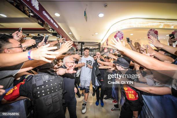 Player Klay Thompson of the Golden State Warriors is welcome by fans in a shopping mall on June 27, 2018 in Taiyuan, China.