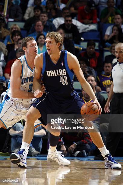 Dirk Nowitzki of the Dallas Mavericks makes a move against Darius Songaila of the New Orleans Hornets during the game at New Orleans Arena on March...