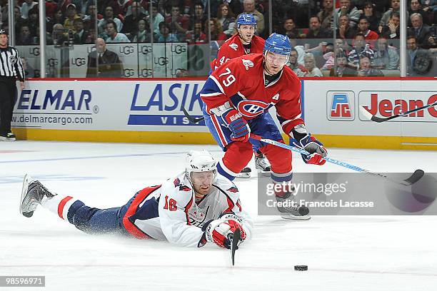 Eric Fehr of the Washington Capitals falls in front of Andrei Markov of the Montreal Canadiens in Game Four of the Eastern Conference Quarterfinals...