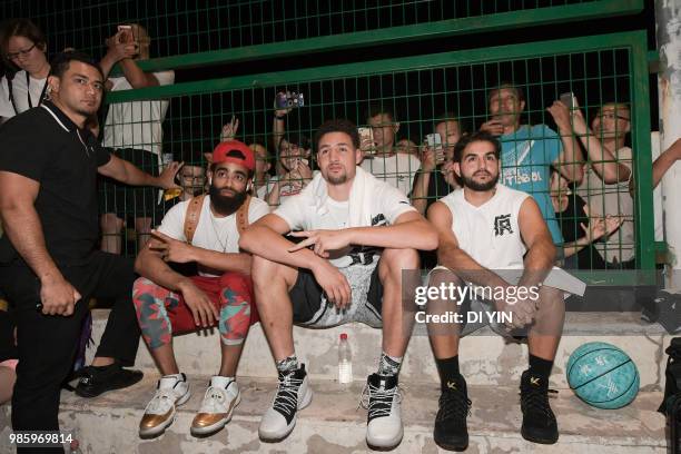 Player Klay Thompson of the Golden State Warriors watch a street basketball with friends on June 27, 2018 in Taiyuan, China.