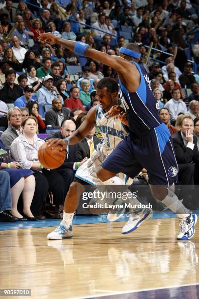 Chris Paul of the New Orleans Hornets drives the ball up court against Jason Terry of the Dallas Mavericks during the game at New Orleans Arena on...