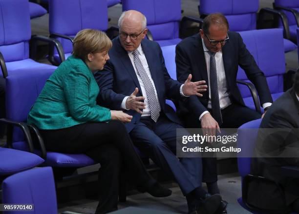 German Chancellor and leader of the German Christian Democrats Angela Merkel speaks with CDU Bundestag faction leader Volker Kauder and Bavarian...