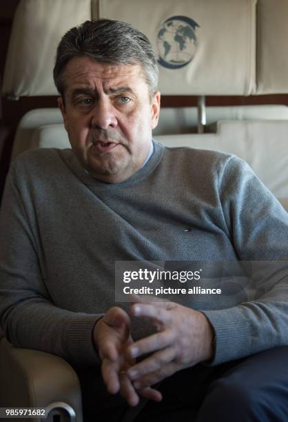 German Foreign Minister Sigmar Gabriel speaking to the press aboard a German Air Force Airbus A319 in Berlin, Germany, 14 February 2018. Gabriel is...