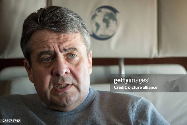 German Foreign Minister Sigmar Gabriel speaking to the press aboard a German Air Force Airbus A319 in Berlin, Germany, 14 February 2018. Gabriel is...