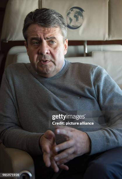 Dpatop - German Foreign Minister Sigmar Gabriel speaking to the press aboard a German Air Force Airbus A319 in Berlin, Germany, 14 February 2018....