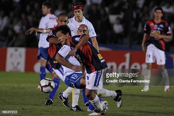 Raul Ferro of Uruguay's Nacional vies for the ball with Morelia's Fernando Salazar during their match as part of the Libertadores Cup 2010 at the...