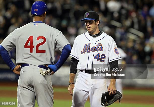 Ike Davis of the New York Mets talks with Derrek Lee of the Chicago Cubs on April 19, 2010 at Citi Field in the Flushing neighborhood of the Queens...