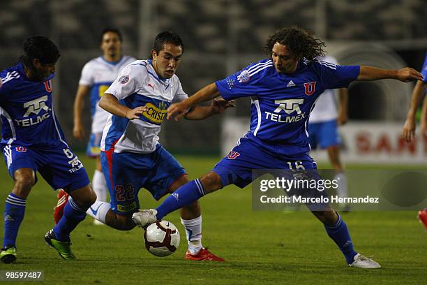 Universidad de Chile's Manuel Iturra battles for the ball with Fernando Meneses of Universidad Catolica during their Santander Libertadores Cup...