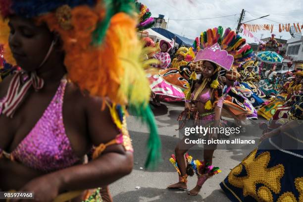Women dressed in traditional carnival costumes dance during a carnival in Nazare de Mata, Brazil, 13 February 2018. Photo: Diego Herculano/dpa