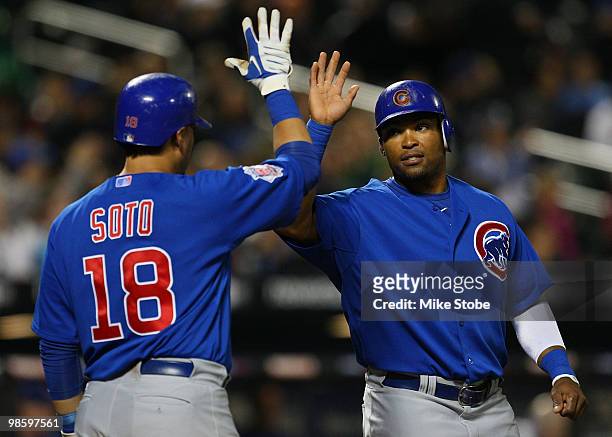 Marlon Byrd of the Chicago Cubs celebrates with Geovany Soto after scoring on a seventh-inning home run by teammate Alfonso Soriano against the New...