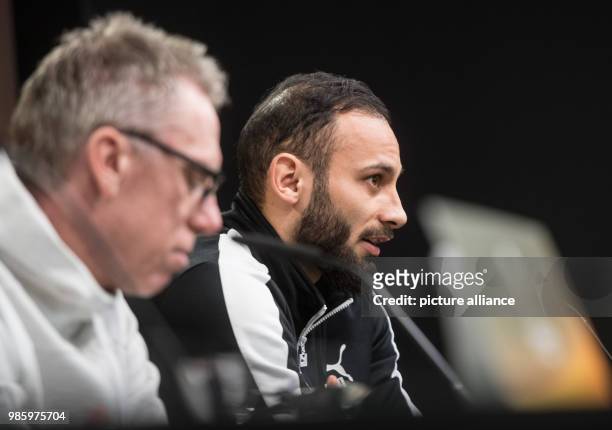 Borussia Dortmund's coach Peter Stoeger and his player Omer Toprak speak during a press conference in Dortmund, Germany, 14 February 2018. Europa...