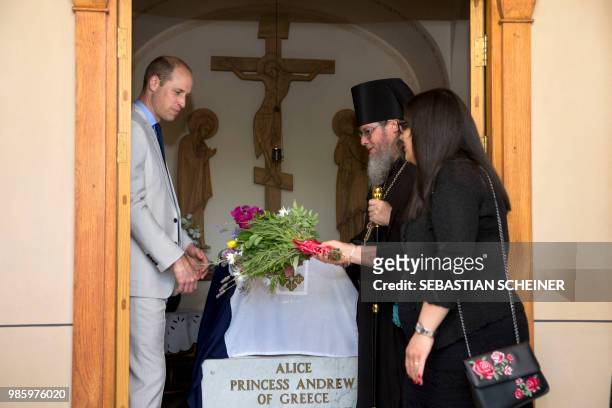 Britain's Prince William visits the grave of his great-grandmother Princess Alice of Battenberg during a visit to the Mary Magdalene Church, in east...
