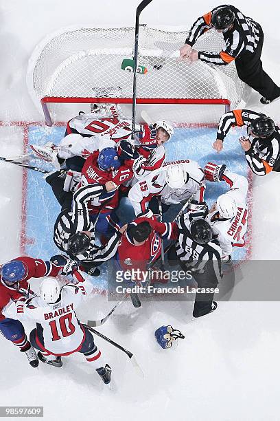 Scott Gomez of the Montreal Canadiens battles with Boyd Gordon of the Washington Capitals in Game Four of the Eastern Conference Quarterfinals during...