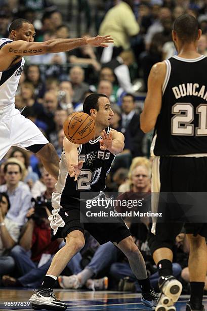 Guard Manu Ginobili of the San Antonio Spurs passes the ball in front of Shawn Marion of the Dallas Mavericks in Game Two of the Western Conference...