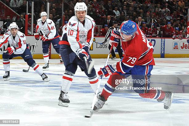 Andrei Markov of the Montreal Canadiens takes a shot in front of Matt Bradley of the Washington Capitals in Game Four of the Eastern Conference...