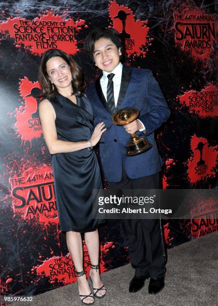 Alanna Ubach and Anthony Gonzalez pose in the press room at the Academy Of Science Fiction, Fantasy & Horror Films' 44th Annual Saturn Awards at The...