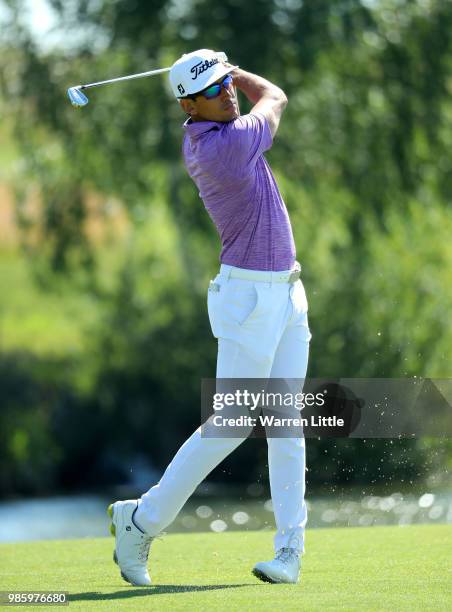 Rafa Cabrera-Bello of Spain plays his second shot on the 1st hole during the first round of the HNA Open de France at Le Golf National on June 28,...