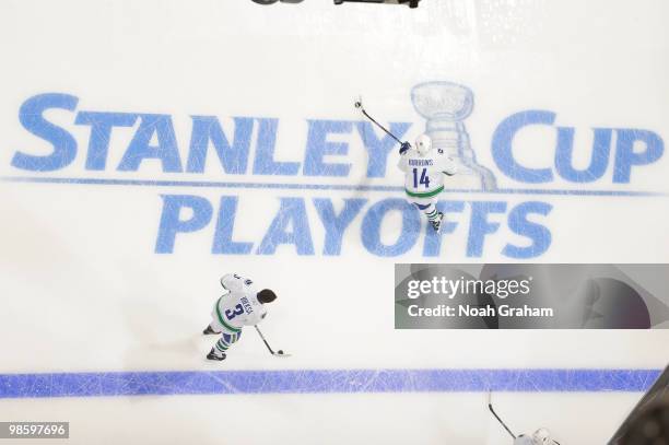 Kevin Bieksa and Alexandre Burrows of the Vancouver Canucks warm up prior to the game against the Los Angeles Kings in Game Four of the Western...