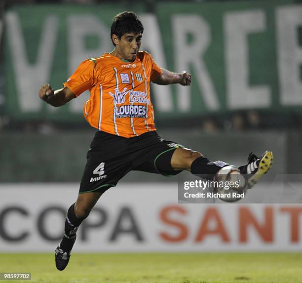 Julio Barraza of Banfield conducts the ball during a match against Deportivo Cuenca as part of the 2010 Libertadores Cup at Florencio Sola Stadium on...