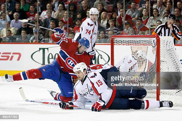 Boyd Gordon of the Washington Capitals clears Benoit Pouliot of the Montreal Canadiens from in front of the net in Game Four of the Eastern...