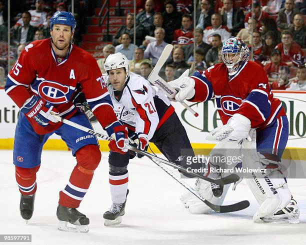 Carey Price of the Washington Capitals clears Brooks Laich of the Washington Capitals from in front of the net in Game Four of the Eastern Conference...