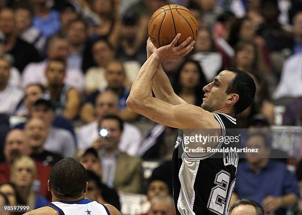 Guard Manu Ginobili of the San Antonio Spurs takes a shot against Shawn Marion of the Dallas Mavericks in Game Two of the Western Conference...