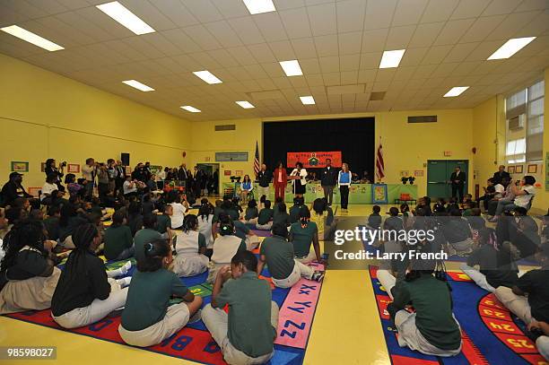 Members of the Vancouver 2010 United States Olympic and Paralympic teams Alana Nichols, Heath Calhoun, first lady Michelle Obama, Principal Shannon...