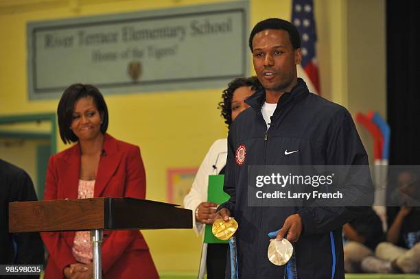 First lady Michelle Obama, Principal Shannon Foster, and Vancouver 2010 United States Olympic gold medalist Shani Davis visit the children of River...