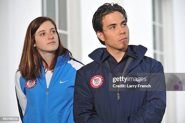 Vancouver 2010 United States Olympians Katherine Reutter and Apolo Ohno observe as fellow Olympians speak to reporters outside the West Wing of the...