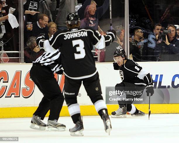 Drew Doughty of the Los Angeles Kings celebrates his goal in front of Jack Johnson for a 1-0 lead over the Vancouver Canucks during the first period...