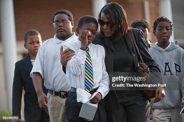 Students, teachers, family and friends attend the wake for Shaw at Garnet-Patterson Middle School principal Brian Betts who was slain in his Silver...