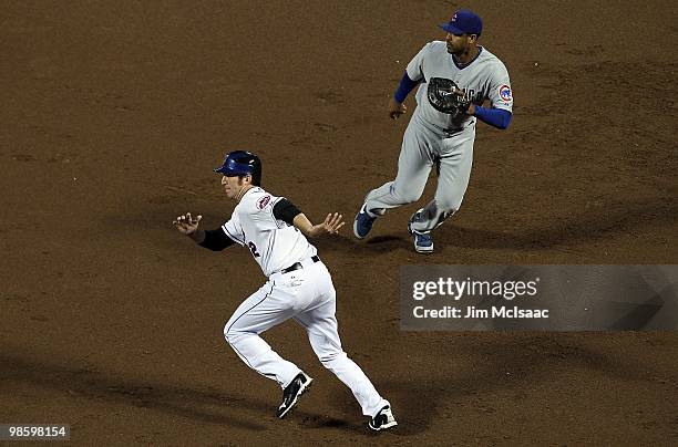 Ike Davis of the New York Mets leads off first base against Derek Lee of the Chicago Cubs during the second inning on April 19, 2010 at Citi Field in...