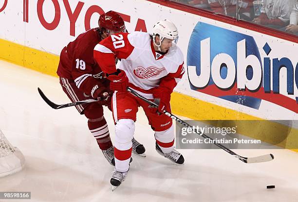 Drew Miller of the Detroit Red Wings skates with the puck in Game Two of the Western Conference Quarterfinals against the Phoenix Coyotes during the...