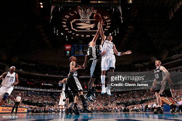 Shawn Marion of the Dallas Mavericks goes in for the dunk against Tim Duncan of the San Antonio Spurs in Game Two of the Western Conference...
