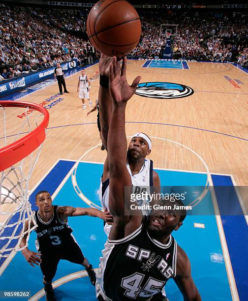 DeJuan Blair of the San Antonio Spurs goes up for the rebound against Brendan Haywood of the Dallas Mavericks in Game Two of the Western Conference...