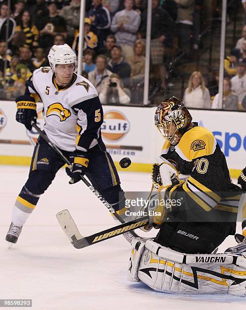 Tuukka Rask of the Boston Bruins stops a shot by Toni Lydman in the first overtime period in Game Four of the Eastern Conference Quarterfinals during...